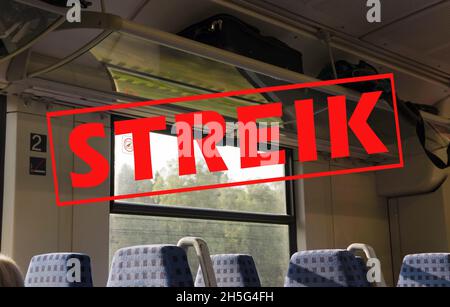 Inside a train with empty seats and German text Streik, meaning strike, political trade union and travel concept, selected focus Stock Photo