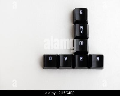 Keys with the word game over with white background Stock Photo