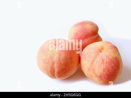 Three of Fresh Ripe Peaches Isolated on White Backdrop Stock Photo
