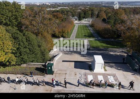 Arlington, United States. 09th Nov, 2021. People place flowers during a centennial commemoration event at the Tomb of the Unknown Soldier, in Arlington National Cemetery in Arlington, Virginia on November 9, 2021. Pool Photo by Alex Brandon/UPI Credit: UPI/Alamy Live News Stock Photo