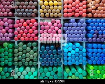 Watercolor pencils are arranged by color in cells on a stationery store  shelf. A variety of professional colored pencils for artists and designers.  Sh Stock Photo - Alamy