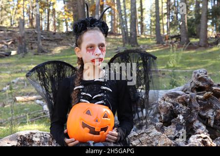 Child dressed up in Halloween costume for trick or treat Stock Photo