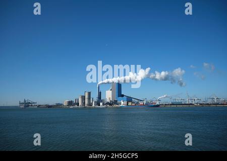 ROTTERDAM, THE NETHERLANDS The Uniper coal power plant in full operation with smoking chimneys at the Maasvlakte near Rotterdam in the Netherlands. Stock Photo