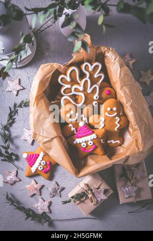 Gingerbread cookies for Christmas in cookie box with stars and small presents Stock Photo