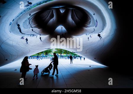 Underneath Sir Anish Kapoor's famous sculpture Cloud Gate, nicknamed The Bean, at Millennium Park in Chicago, IL, USA Stock Photo