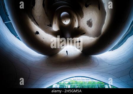 Underneath Sir Anish Kapoor's famous sculpture Cloud Gate, nicknamed The Bean, at Millennium Park in Chicago, IL, USA Stock Photo