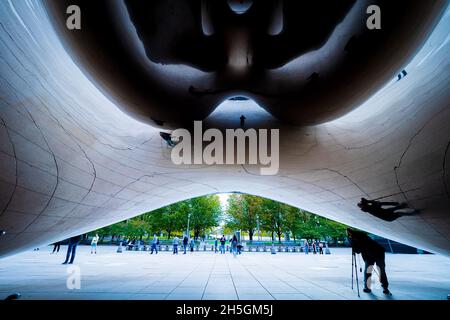 Underneath Sir Anish Kapoor's famous sculpture Cloud Gate, nicknamed The Bean, at Millennium Park in Chicago, IL, USA Stock Photo