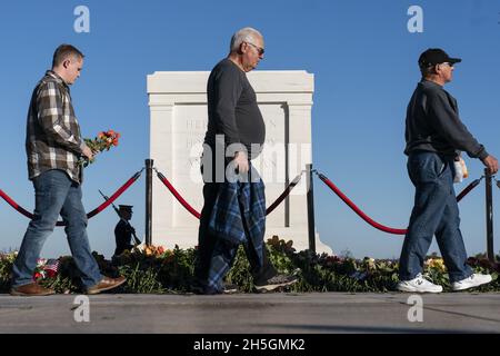 Arlington, United States. 09th Nov, 2021. People walk to place flowers during a centennial commemoration event at the Tomb of the Unknown Soldier, in Arlington National Cemetery, Tuesday, November 9, 2021, in Arlington, Virginia. Pool Photo by Alex Brandon/UPI Credit: UPI/Alamy Live News Stock Photo