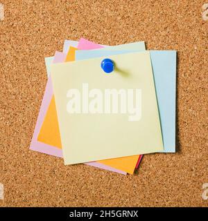 various colors sticky post notes with pushpin cork board. Resolution and high quality beautiful photo Stock Photo