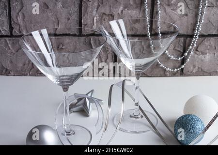 christmas decor in silvery gold tones, empty martini glass Stock Photo