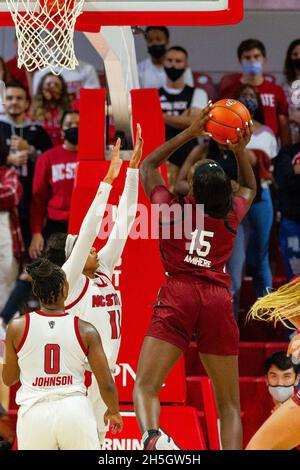 Raleigh, NC, USA. 9th Nov, 2021. NC State Wolfpack forward Jakia Brown-Turner (11) defends the layup from South Carolina Gamecocks forward Laeticia Amihere (15) in the second half of the NCAA Womens Basketball matchup at Reynolds Coliseum in Raleigh, NC. (Scott Kinser/Cal Sport Media). Credit: csm/Alamy Live News Stock Photo