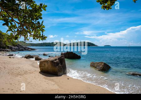 Ao Sane Jungle beach Phuket Thailand, beach with rocks and blue ocean in Phuket Thailand Stock Photo