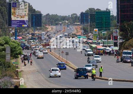 Traffic on the newly widened Ngong Road, Karen, Nairobi.  The 2.3 billion Kenya shilling project was carried out by the Chinese firm, Quinjian Interna Stock Photo