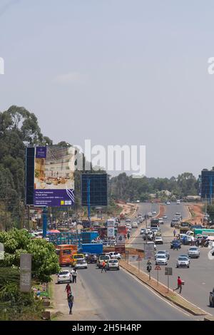 Traffic on the newly widened Ngong Road, Karen, Nairobi.  The 2.3 billion Kenya shilling project was carried out by the Chinese firm, Quinjian Interna Stock Photo