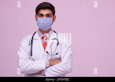 Doctor Wearing Medical Mask on isolated background. Stock Photo