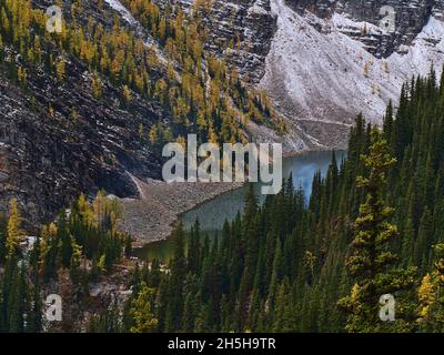 Beautiful aerial view of famous Lake Agnes located in a valley in the Rocky Mountains near Lake Louise, Banff National Park, Canada in autumn season. Stock Photo