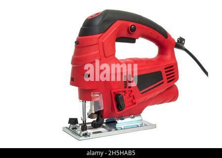 A jigsaw power tool isolated on white background. Electric jig saw. Professional electric jig saw isolated on white background. Electric fretsaw on a Stock Photo