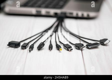 A large number of different connectors for connecting various gadgets via USB port to a laptop or computer. The concept of multitasking Stock Photo