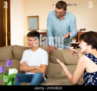 Parents scolding their young son Stock Photo