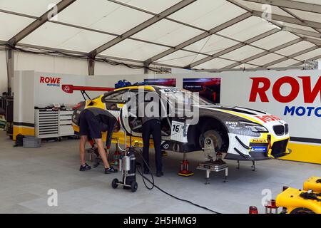 Mechanics work in pit, pit lane on DTM race car, German Torenwagen Masters of racing driver Timo Glock, Rowe Racing BMW M6 GT3, Norisring, city Stock Photo