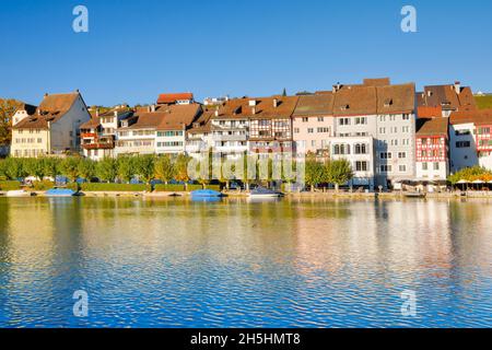 View from the banks of the Rhine over the Rhine towards the old town of Eglisau with reflection on the river water, Canton Zurich, Switzerland