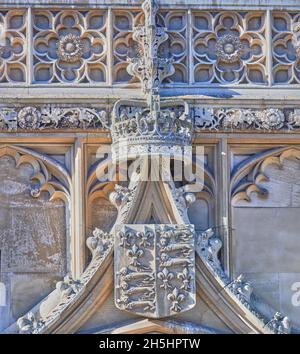 Royal crown and coat of arms in stone above the main entrance to King's college, Cambridge university, England. Stock Photo