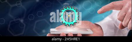Business process concept above a smartphone held by a man Stock Photo