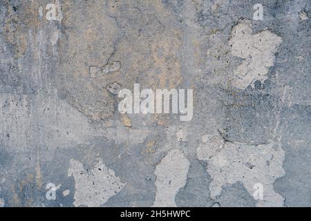 The background is made of rugged, gray blue colored plaster walls. Stock Photo