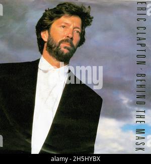 Vintage single record cover - Clapton, Eric - 18 - Behind The Mask - D - 1987 Stock Photo