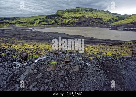 Laufskalar Cairn (Laufskalavaroa), Myrdalssandur Plain, Iceland.Moss-covered lava field Laufskálavarða, at back volcano Katla, Kirkjubæjarklaustur, Su Stock Photo