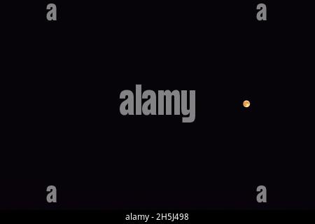 Full moon on the dark night sky. Stock Photo