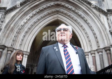 Retired police officer John Murray accompanied by Donna Griffin of the Metropolitan Women's Police Association arrives at the Royal Courts of Justice, central London, where he is bringing a civil claim for a nominal amount of £1 against Saleh Ibrahim Mabrouk, a former aide to ex-Libyan leader Colonel Muammar Gaddafi, in a bid to air the 'full evidence' surrounding the death of Pc Yvonne Fletcher in 1984. Picture date: Wednesday November 10, 2021. Stock Photo