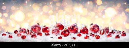 Christmas Red Balls With Golden Lights On White Fur - Abstract Defocused Card Stock Photo