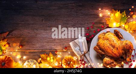 Turkey - Thanksgiving Celebration - Table Setting With Silverware And Autumnal Decoration On Wooden Plank Stock Photo