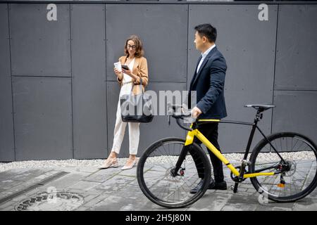Business people drinking coffee and using phones Stock Photo
