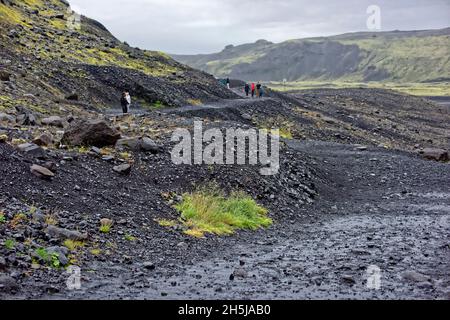 Laufskalar Cairn (Laufskalavaroa), Myrdalssandur Plain, Iceland.Moss-covered lava field Laufskálavarða, at back volcano Katla, Kirkjubæjarklaustur, Su Stock Photo