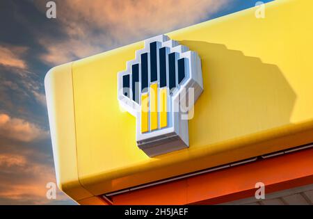 Samara, Russia - may 14, 2016: Emblem of the oil company Rosneft against the blue sky. Rosneft is one of the largest russian oil companies Stock Photo