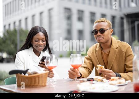 Business couple having lunch outdoors Stock Photo