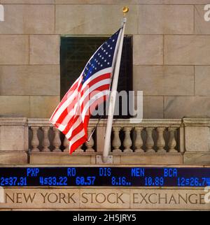 New York Stock Exchange building, Stock market data, American flag. Wall Street, Financial District, Lower Manhattan. Stock ticker, close-up. USA Stock Photo