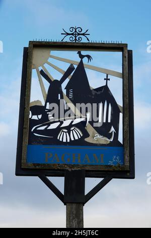 Pagham graphic designed road sign seen against the sky. Stock Photo