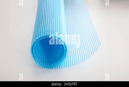 Blue reinforcing construction mesh for wall strengthening on white background, isolate. Stock Photo