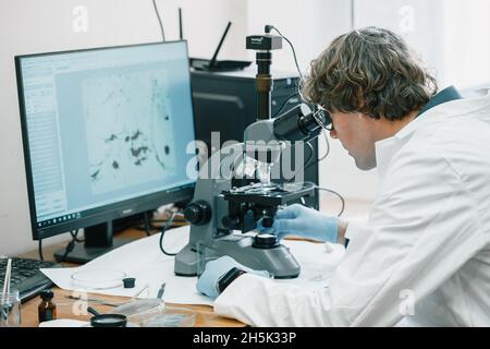 Scientist examines cannabis sativa mold through an electron microscope Stock Photo