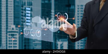 business chart and graph. Businessman touching virtual hologram. business technology concept Stock Photo