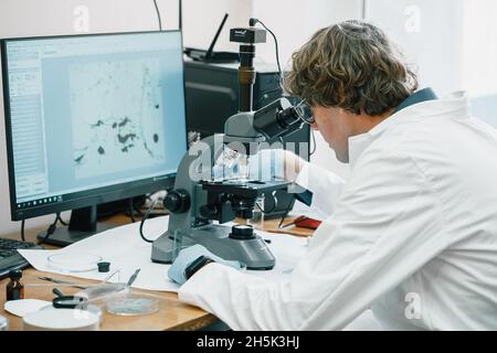 Scientist examines cannabis sativa mold through an electron microscope Stock Photo