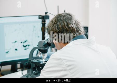 Scientist examines cannabis sativa mold through an electron microscope Stock Photo