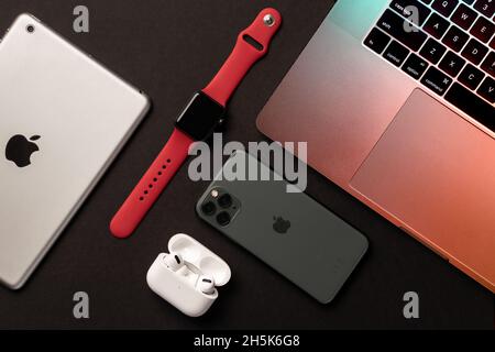Flat Lay of different apple products on a grey background. Stock Photo
