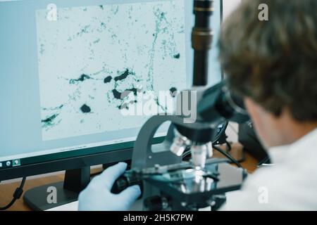 Scientist examines cannabis sativa mold through an electron microscope Stock Photo