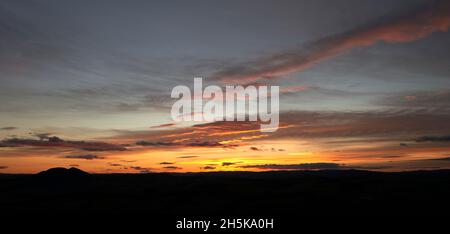 Stunning autumnal sunset behind The Eildon Hills in the Scottish Borders Stock Photo