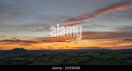 Stunning autumnal sunset behind The Eildon Hills in the Scottish Borders Stock Photo