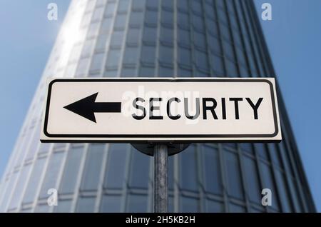 Security concept. White sign with arrow with inscription security. Direction sign. Arrows on a pole pointing in one direction Stock Photo
